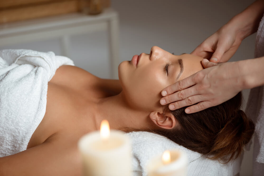 Woman receiving a head massage