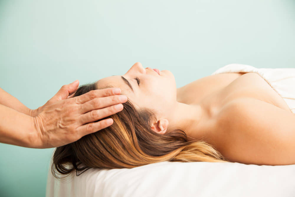 Woman receiving head massage